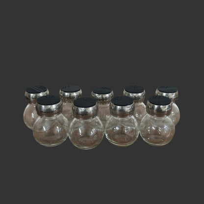 A Set of 09 Spice Jars
